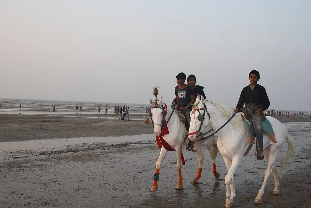 Tourist enjoying horse ride on Jampora Beach ,Daman